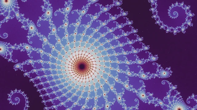 In the neutral palette, one large spiral of white and pale blue filigree with a red center, on purple.