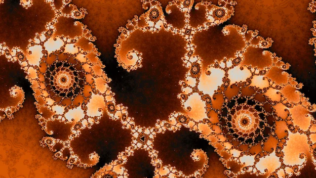 Two large spirals of cream and amber filigree on dark brown.