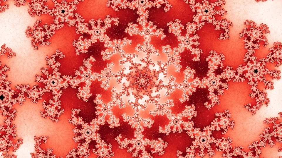 Spiraling arms of red and white filigree dotted with tiny black copies, around a pale center.
