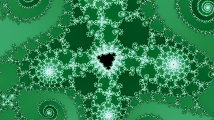 A finished wallpaper in the Multibrot d = 4 family, drawn in smooth, with a small dark minibrot at its center and the dense structure of its halo around it.