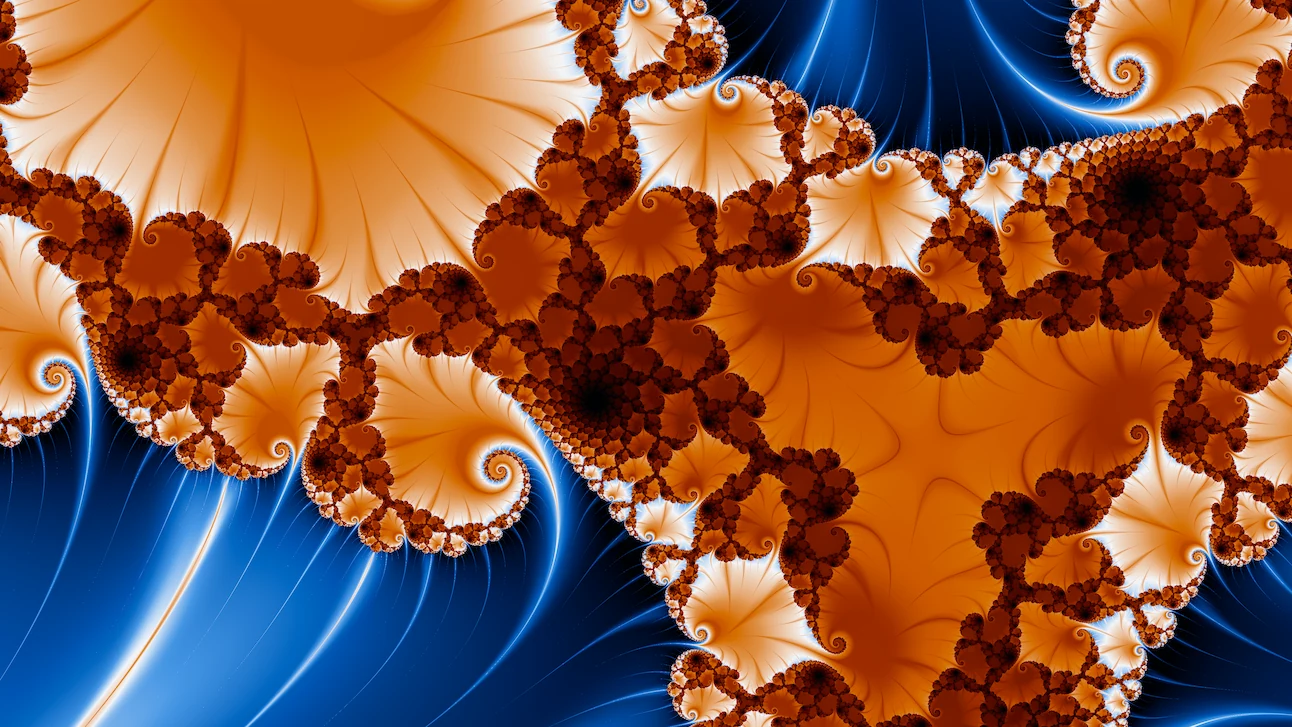 A degree-three Julia set in burnt orange and cobalt blue: a branching band of dark rust filigree, fanned with pale orange and curling into spirals at its edges, across a deep blue ground streaked with fine light threads.